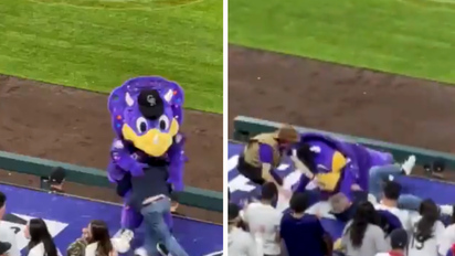 Colorado Rockies mascot, Dinger, tackled by fan during baseball