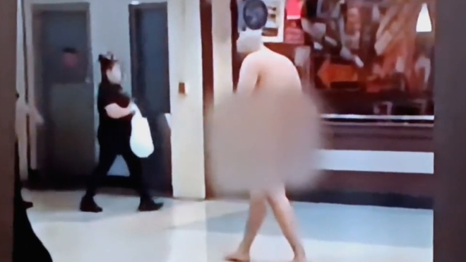 Video thumbnail for Man casually strolls around Dallas airport completely naked