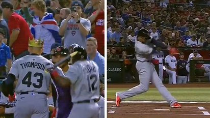 Teammates crown Trayce Thompson after he puts the Great Britain ahead  against Team USA
